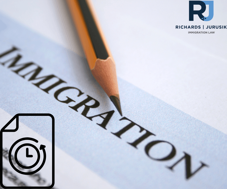 Close-up of a pencil writing 'IMMIGRATION' on a document, with the RJ Richards | Jurusik Immigration Law logo in the top-right corner.